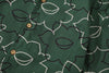 close up of matching pattered chest pocket on a Hong Kong made GOC Studio green daffodil Tencel linen shirt