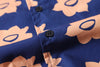 close up of corozo button closure on a Hong Kong made GOC Studio navy and orange daffodil cotton poplin shirt