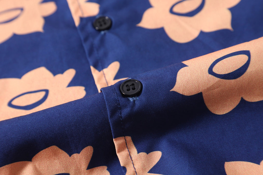 close up of corozo button closure on a Hong Kong made GOC Studio navy and orange daffodil cotton poplin shirt