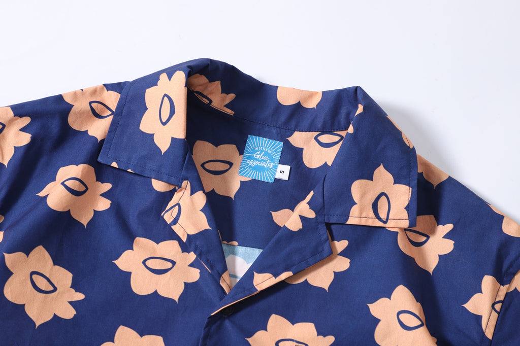 collar view of a Hong Kong made GOC Studio navy and orange daffodil cotton poplin shirt