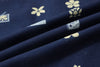 close up of navy retro pixelated floral Tencel linen fabric texture