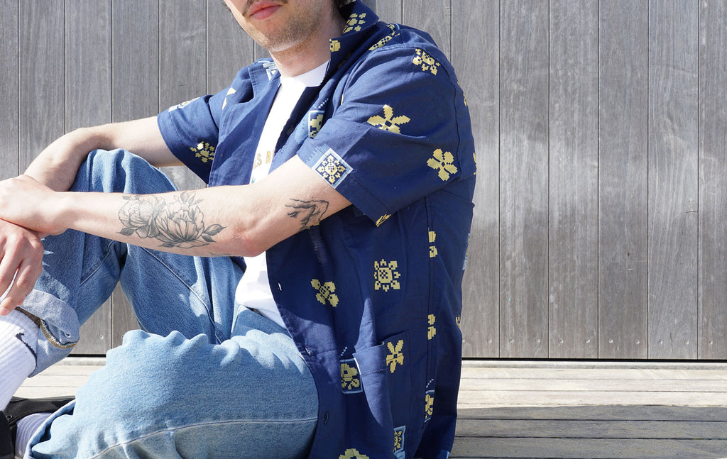 model close up shot of a Hong Kong made GOC Studio navy retro pixelated floral Tencel linen shirt