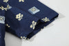 close up of sleeve hem and stitching detail on a Hong Kong made GOC Studio navy retro pixelated floral Tencel linen shirt