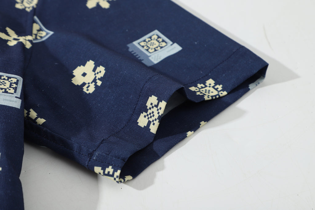 close up of sleeve hem and stitching detail on a Hong Kong made GOC Studio navy retro pixelated floral Tencel linen shirt