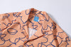 collar view of a Hong Kong made GOC Studio orange daffodil cotton poplin shirt