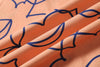 close up of orange daffodil cotton poplin fabric texture