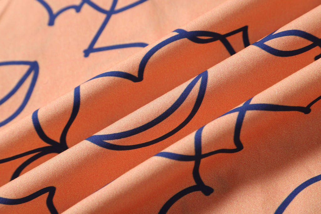close up of orange daffodil cotton poplin fabric texture