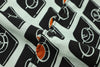 close up of corozo button closure on a Hong Kong made GOC Studio white and black circle windows Tencel linen shirt