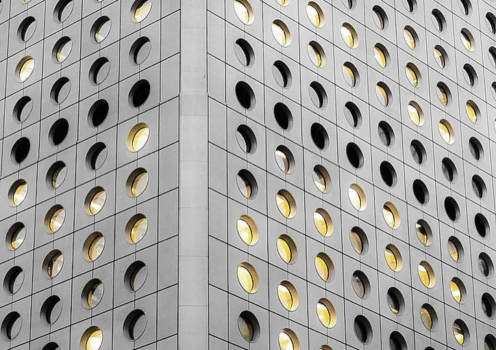 reference image mid-shot of the iconic 1970s Jardine House architecture in Hong Kong