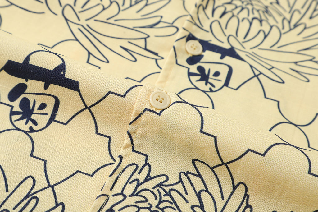 close up of corozo button closure on a Hong Kong made GOC Studio yellow chrysanthemum Tencel linen shirt