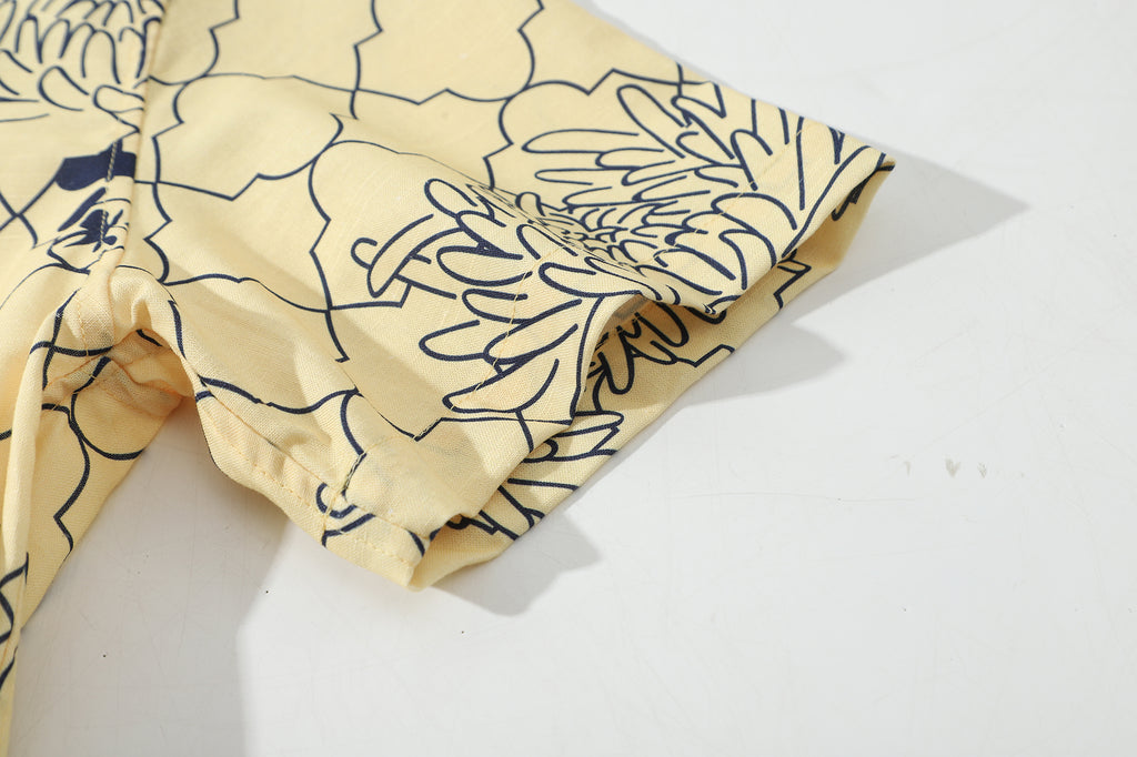 close up of sleeve hem and stitching detail  on a Hong Kong made GOC Studio yellow chrysanthemum Tencel linen shirt
