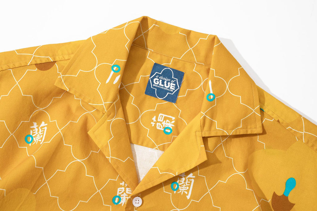 collar view of a Hong Kong made GOC Studio yellow orchid cotton shirt