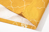 bottom hem view of a Hong Kong made GOC Studio yellow orchid cotton shirt