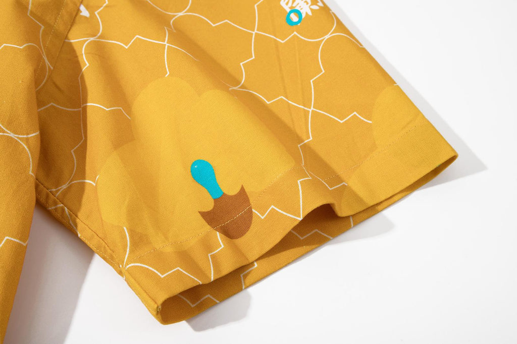 close up of sleeve hem and stitching detail on a Hong Kong made GOC Studio yellow orchid cotton shirt