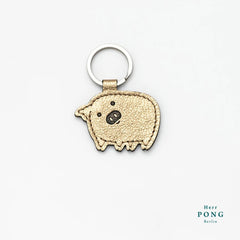 Herr Pong Pig leather Keychain - Gold - GLUE Associates